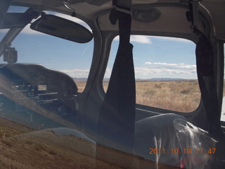 662 7qa. Sand Wash airstrip - view through N8377W windows