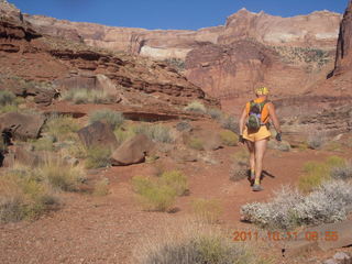 1688 7qb. Canyonlands National Park - Lathrop trail hike - Adam hiking - back (tripod)