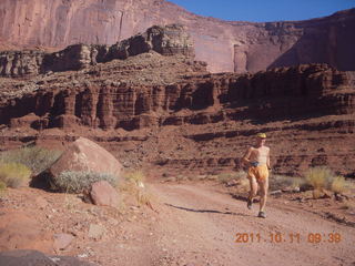 79 7qb. Canyonlands National Park - Lathrop trail hike - Adam running (tripod)