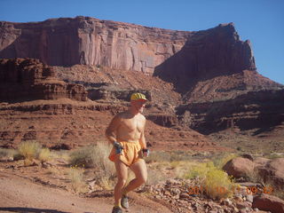 82 7qb. Canyonlands National Park - Lathrop trail hike - Adam running (tripod)