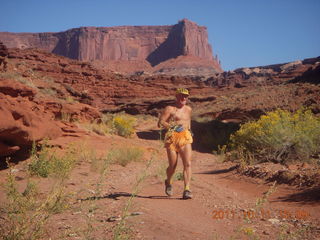 84 7qb. Canyonlands National Park - Lathrop trail hike - Adam running (tripod)