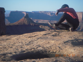 1705 7qc. Dead Horse Point hike - Big Horn - Adam trying to sit down in ten seconds