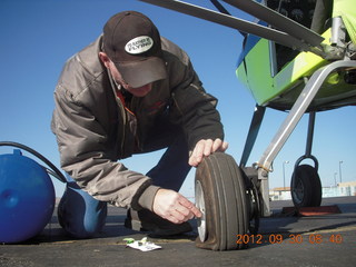 15 81w. fixing a valve for Larry S's flat tire at Gallup (GUP)