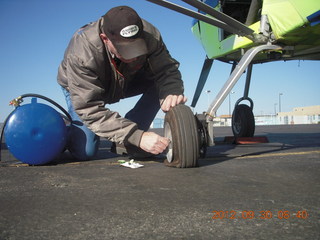 16 81w. fixing a valve for Larry S's flat tire at Gallup (GUP)