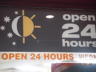 21 83d. Cairns, Australia - Open 24 Hours sign