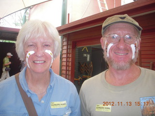 151 83d. Tjapukai Aboriginal Cultural Park - tourist and Adam with painted faces