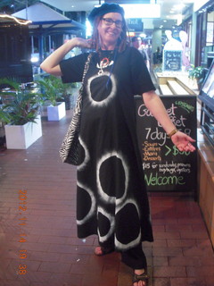 314 83e. Cairns - Night Market area - lady with cool solar-eclipse dress