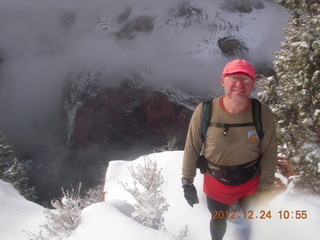 1957 84q. Zion National Park - cloudy, foggy Observation Point hike - Adam at the top