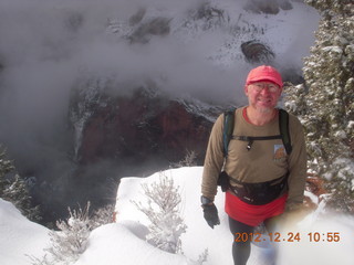 140 84q. Zion National Park - cloudy, foggy Observation Point hike - Adam at the top