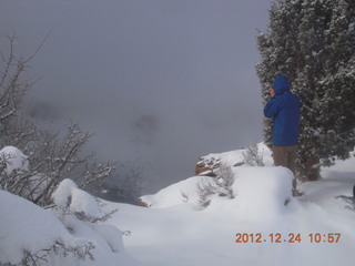 147 84q. Zion National Park - cloudy, foggy Observation Point hike - another hiker at the top