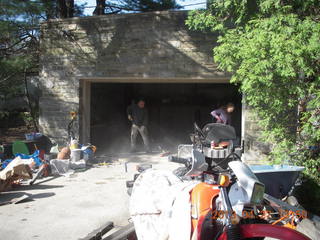Ivan sweeping dusty garage