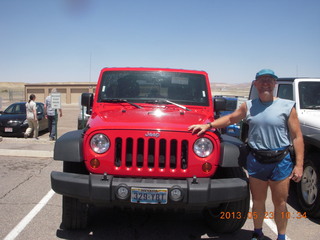 44 89p. Adam and red Jeep
