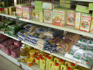 62 8f1. Uganda - drive north to Chobe Sarari Lodge - local store selection