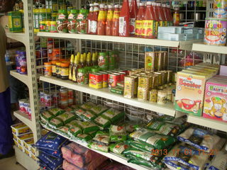 63 8f1. Uganda - drive north to Chobe Sarari Lodge - local store selection