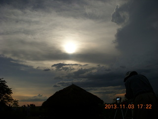 Uganda - eclipse site - sun behind clouds