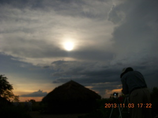 Uganda - eclipse site - sun behind clouds