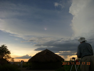 Uganda - eclipse site - total solar eclipse seen through a cloud