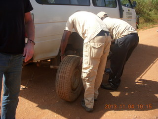 Uganda - drive to chimpanzee park - fixing a flat tire