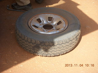 Uganda - drive to chimpanzee park - fixing a flat tire