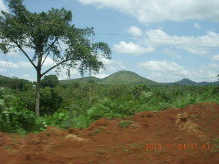 Uganda - drive to chimpanzee park - fixing a flat tire