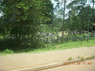 Uganda - drive to chimpanzee park - fixing a flat tire