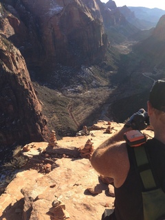 2128 8gt. Zion National Park - Angels Landing hike - Adam taking a picture of the ledge at the top
