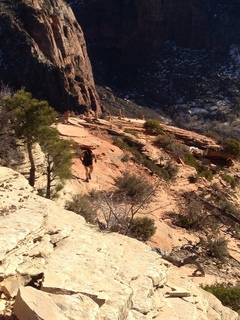 2129 8gt. Zion National Park - Angels Landing hike - at the top - Adam hiking to the ledge