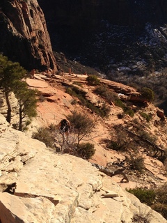 2130 8gt. Zion National Park - Angels Landing hike - at the top - Adam hiking to the ledge