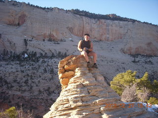 2137 8gt. Zion National Park - Angels Landing hike - at the top - Adam sitting on a hill