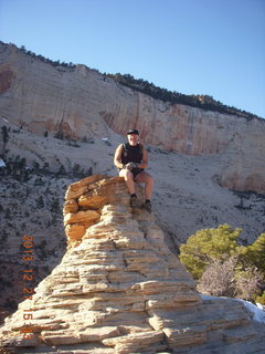 2138 8gt. Zion National Park - Angels Landing hike - at the top - Adam sitting on a hill
