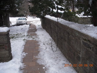 526 8j9. snow in walkway with downed wires Betsy's house