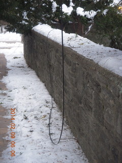 527 8j9. snow in walkway with downed wires Betsy's house