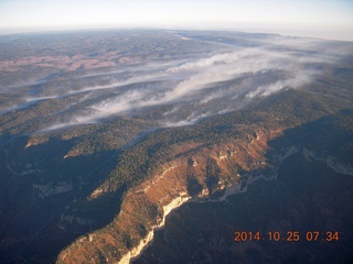 1784 8sr. aerial - Grand Canyon just after dawn - low clouds on the north rim