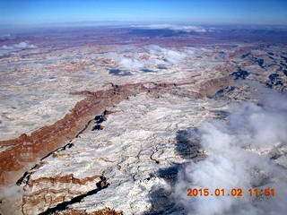 33 8v2. aerial - snow and clouds and canyon