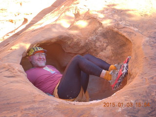 2570 8v3. Arches National Park - Devils Garden hike - Adam in hole in the rock - tripod and timer