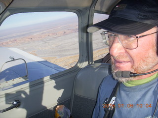 1506 8v6. Adam flying N8377W over snowy canyonlands