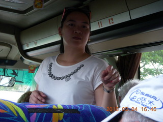 Indonesia - puppet show stop - our guide counting people on the bus