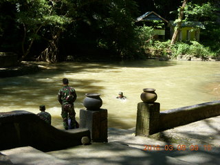 Indonesia - Bantimurung Water Park - soldiers in the river