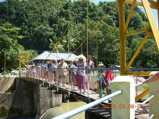 Indonesia village - people crossing the river