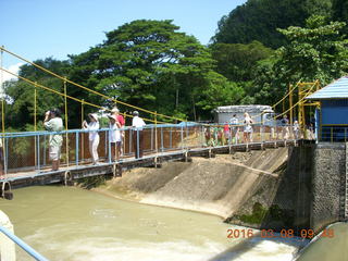 117 998. Indonesia village - people crossing the river