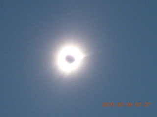 Makassar Straight total solar eclipse - clouds in the sky with wires