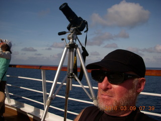 Makassar Straight total solar eclipse - Adam with eclipse glasses