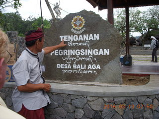 Indonesia - Bali - Tenganan sign with our guide