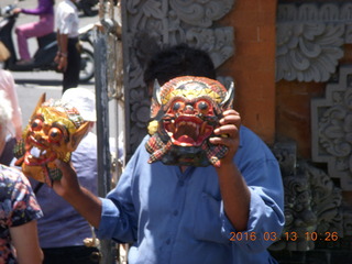 Indonesia - Bali - temple at Klungkung - guy selling masks