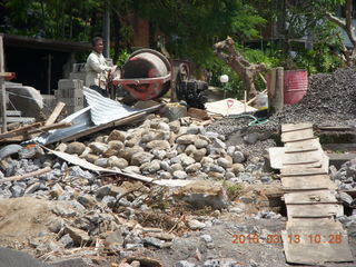 Indonesia - Bali - temple at Klungkung - outside, guys working in the heat