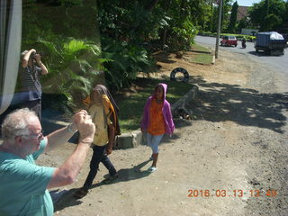 Indonesia - Bali - bus ride - people taking pictures of monument