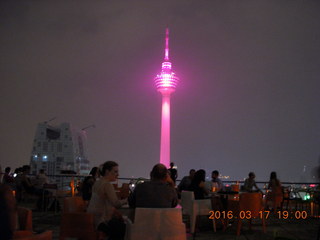 Malaysia - Kuala Lumpur - Heli Lounge Bar - Adam sitting - twin Petronas towers