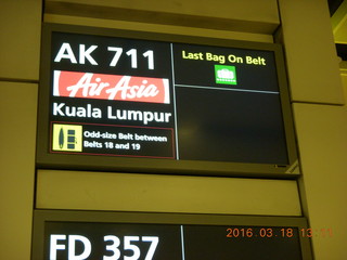 Air Asia airplane with ads on the luggage racks