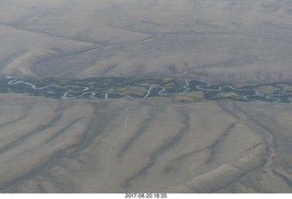 aerial - Riverton to Rock Springs - winding river in wide wash