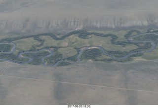 aerial - Riverton to Rock Springs - winding river in wide wash